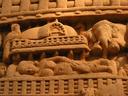 The gate carvings tell the story of Buddha. This scene shows Buddhas mother dreaming of a white elephant at the moment of the Buddhas conception.